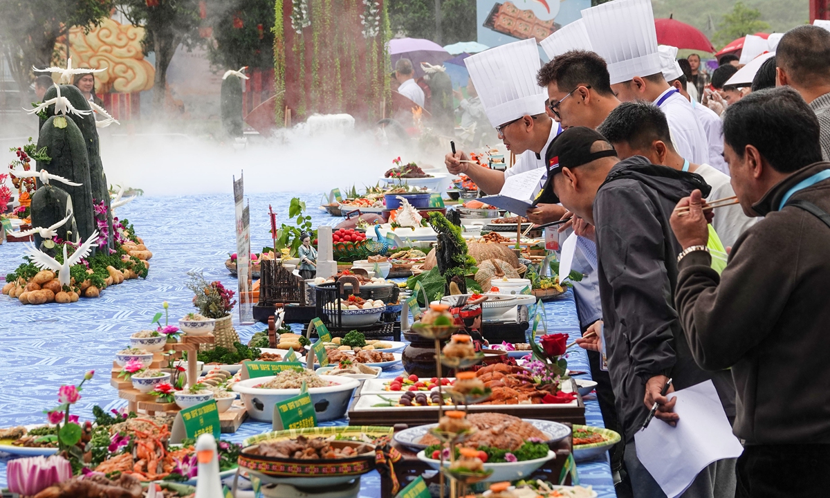 Judges evaluate entries at the Guangxi Intangible Cultural Heritage Specialty Cuisine Competition in Nanning on April 10, 2024, as part of the March 3 Festival celebrations. Photo: VCG