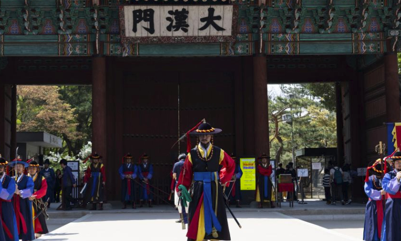 Guards wearing traditional uniforms take part in the royal guard-changing ceremony at Deoksugung Palace in Seoul, South Korea, April 14, 2024. The Royal Guard Changing Ceremony is a popular spectacle for tourists visiting Seoul. (Photo by Jun Hyosang/Xinhua)