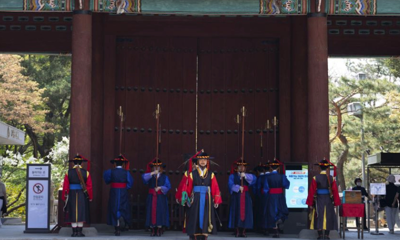 Guards wearing traditional uniforms take part in the royal guard-changing ceremony at Deoksugung Palace in Seoul, South Korea, April 14, 2024. The Royal Guard Changing Ceremony is a popular spectacle for tourists visiting Seoul. (Photo by Jun Hyosang/Xinhua)
