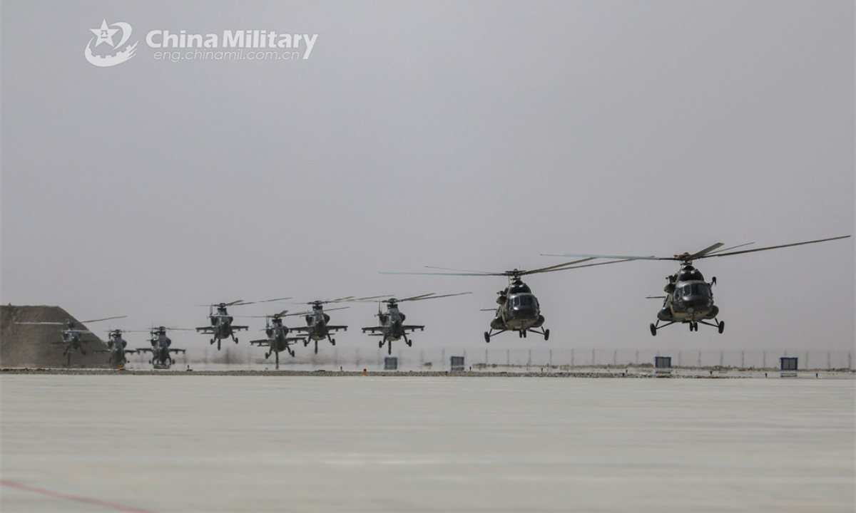Helicopters attached to a brigade under the PLA 76th Group Army lift off simulateously during a 24-hour flight training exercise on April 6, 2024. (eng.chinamil.com.cn/Photo by Wang Pengfei)