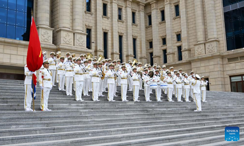 A military band performs at the Chinese People's Liberation Army (PLA) Navy Museum to celebrate the 75th founding anniversary of the Chinese PLA Navy in Qingdao, east China's Shandong Province, April 20, 2024. (Xinhua/Li Ziheng)