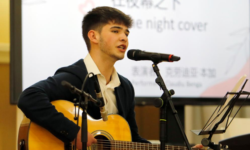 A student performs during an event organized by Confucius Institute of Transilvania University of Brasov to mark the UN Chinese Language Day in Brasov, central Romania, April 19, 2024. (Photo by Cristian Cristel/Xinhua)
