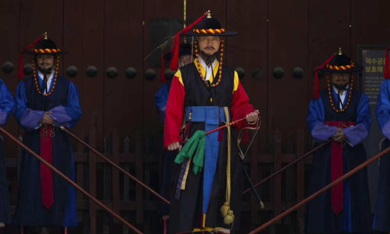 Guards wearing traditional uniforms take part in the royal guard-changing ceremony at Deoksugung Palace in Seoul, South Korea, April 14, 2024. The Royal Guard Changing Ceremony is a popular spectacle for tourists visiting Seoul. (Photo by Jun Hyosang/Xinhua)
