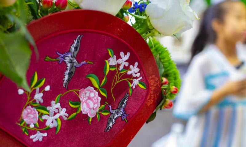 An embroidery is displayed at the Yunnan booth of the fourth China International Consumer Products Expo (CICPE) in Haikou, capital city of south China's Hainan Province, April 14, 2024. A batch of domestic brands have attracted a lot of visitors at the expo. (Xinhua/Tian Weiwei)