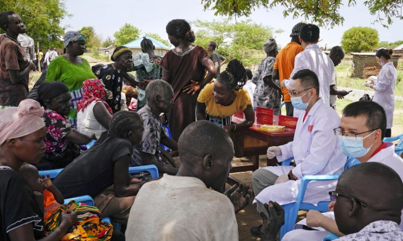Doctors from the 11th batch of Chinese medical team provide free treatment for people in Nakitun Village, Juba, South Sudan, April 10, 2024. The 11th batch of Chinese medical team to South Sudan has been providing medical services at the Juba Teaching Hospital since September 2023. As of early April, 2024, the medical team had provided 6,873 outpatient and emergency services, completed 82 surgeries, organized six free treatment event, and provided professional training for over 1,100 local medical personnel. (Xinhua/Han Xu)