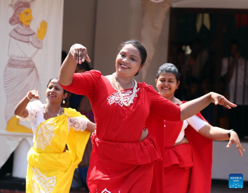 Teachers perform traditional folk dances for the Sinhala and Tamil New Year, a traditional festival to be observed on the coming weekend, at a school in Colombo, Sri Lanka, April 9, 2024. (Photo: Xinhua)
