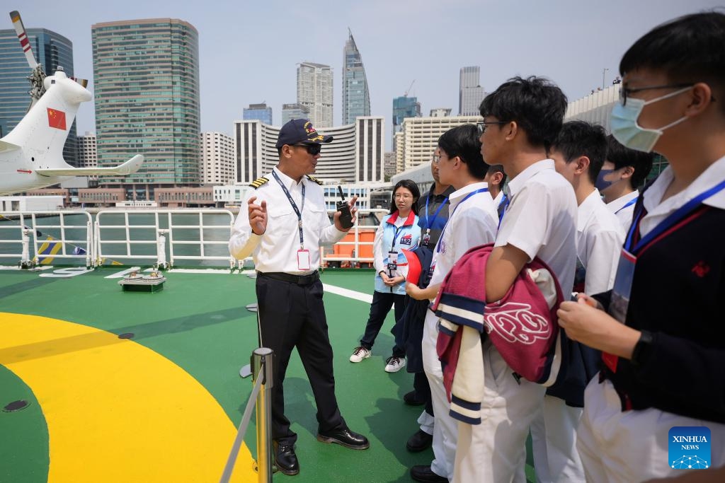 Ship-borne helicopter captain Zhang Dong introduces polar flight to visitors on China's icebreaker Xuelong 2 in Hong Kong, south China, April 10, 2024. China's first domestically made icebreaker Xuelong 2 arrived in Hong Kong for a five-day visit, expecting to receive 8,500 visitors. Xuelong 2, which came to Hong Kong for the very first time, entered the Ocean Terminal in Tsim Sha Tsui on Monday morning after completing China's 40th Antarctic expedition.(Photo: Xinhua)