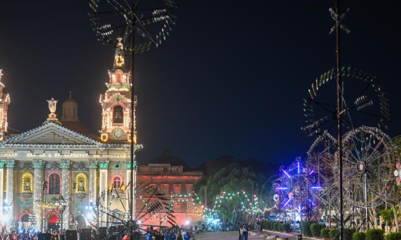 People wait for the explosion of fireworks during a pre-festival event of the Malta International Fireworks Festival in Floriana, Malta, April 13, 2024. (Photo by Jonathan Borg/Xinhua)