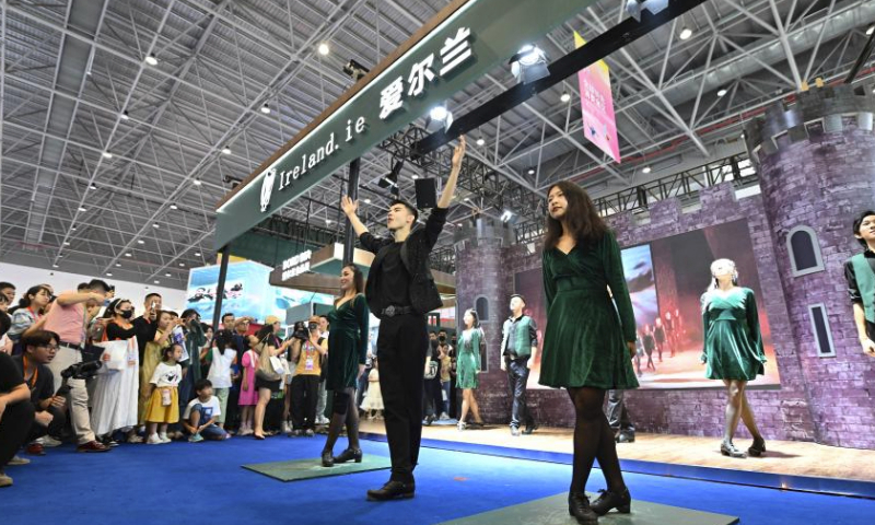Artists perform tap dance at the national pavilion of Ireland during the fourth China International Consumer Products Expo (CICPE) in Haikou, capital city of south China's Hainan Province, April 14, 2024. (Xinhua/Guo Cheng)