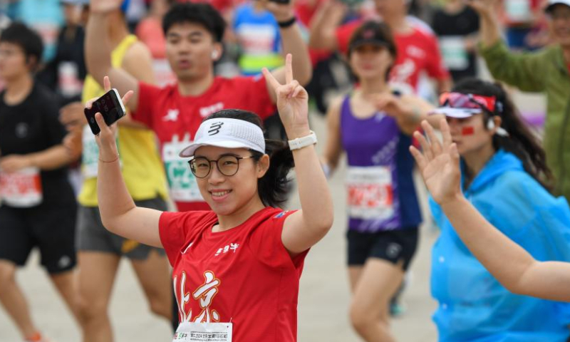 Runners start during the Bejing Half Marathon 2024 in Beijing, capital of China, April 14, 2024. (Xinhua/Ju Huanzong)
