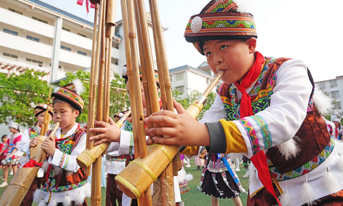 Children play the lusheng at a primary school in Rongshui Miao Autonomous County, Liuzhou, South China's Guangxi Zhuang Autonomous Region, on April 9, 2024, during the March 3 Festival. Photo: VCG