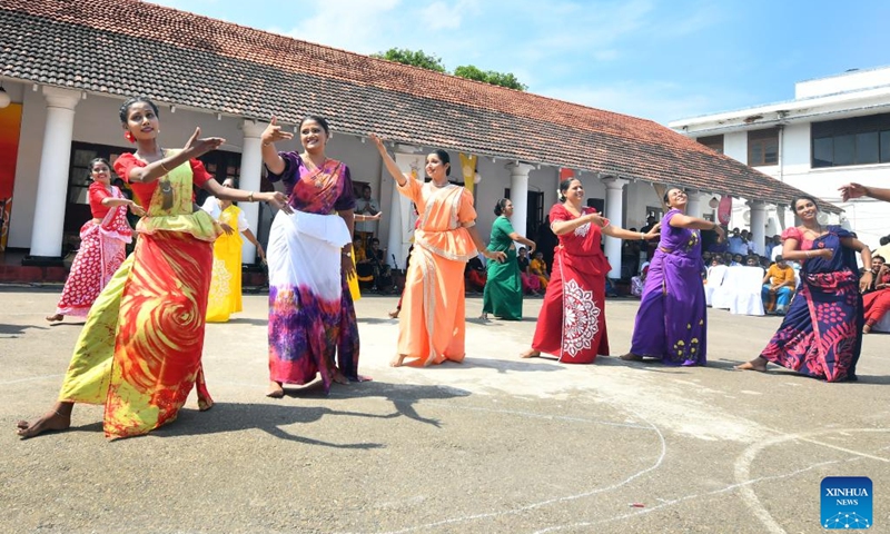Teachers perform traditional folk dances for the Sinhala and Tamil New Year, a traditional festival to be observed on the coming weekend, at a school in Colombo, Sri Lanka, April 9, 2024. (Photo: Xinhua)