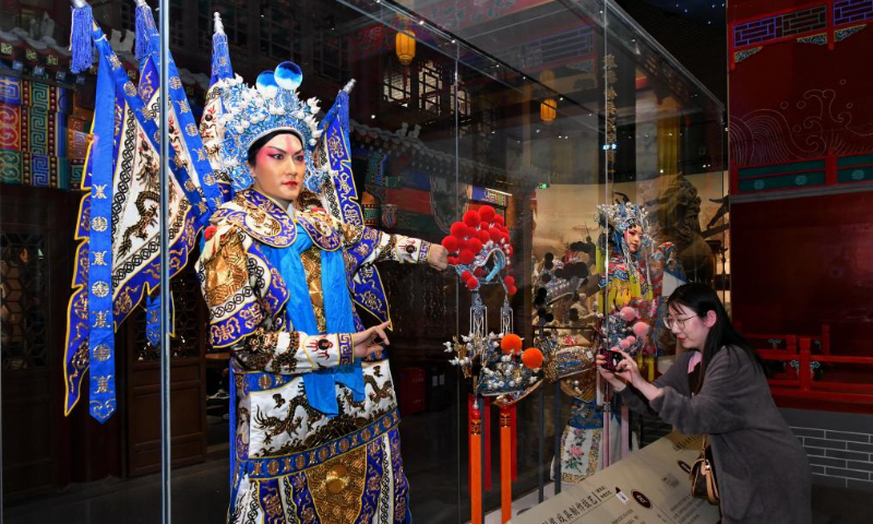 A tourist takes photos in an exhibition hall on intangible cultural heritage alongside China's Grand Canal, in Cangzhou, north China's Hebei Province, April 19, 2024. China's Grand Canal, a vast waterway connecting the northern and southern parts of China, was listed as a UNESCO World Heritage Site in 2014. The exhibition hall in Cangzhou showcases the intangible cultural heritage from 8 provinces and municipalities alongside the canal. (Xinhua/Yang Shiyao)