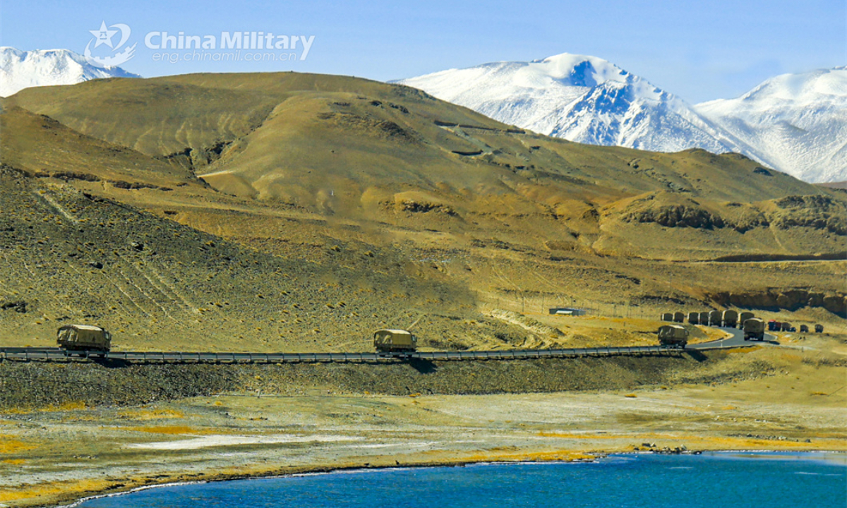 A convoy of military trucks attached to a regiment under the PLA Army moves on a zigzag road in the hinterland of a plateau region during a driving skill training exercise on April 7, 2024. (eng.chinamil.com.cn/Photo by Shang Luhang)