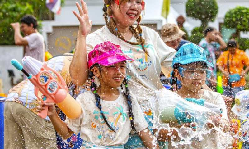 People have fun as they celebrate the Songkran festival in Ayutthaya, Thailand, April 13, 2024. The Songkran festival, the traditional Thai New Year, is celebrated from April 13 to 15 every year, during which people express greetings by splashing water on each other. (Xinhua/Wang Teng)