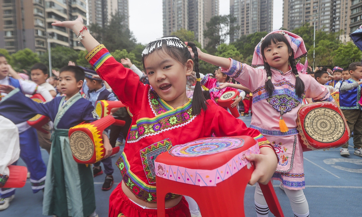 Students from a primary school in Nanning, South China's Guangxi Zhuang Autonomous Region, perform a bench and drum dance for the March 3 Festival on April 9, 2024. Photo: VCG