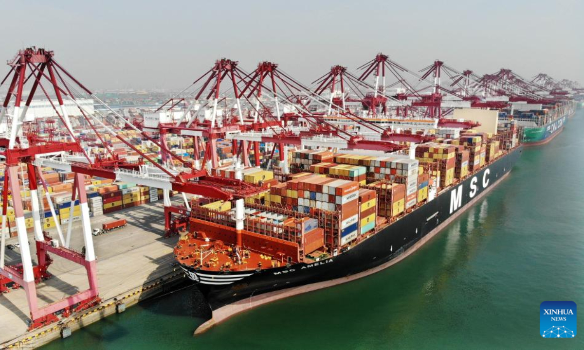 A drone photo shows a cargo ship docking at Qingdao Port in east China's Shandong Province, March 13, 2024. Photo:Xinhua