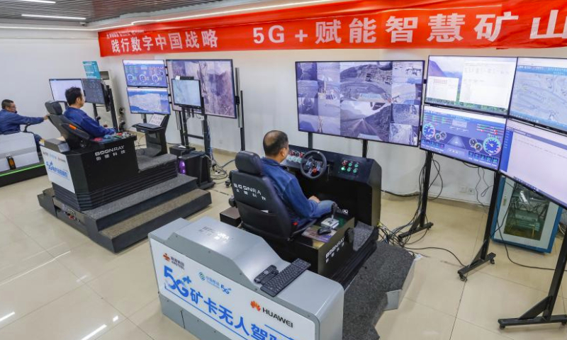 Technicians work at a smart control center of an iron ore mine branch of Pangang Group in Panzhihua City, southwest China's Sichuan Province, April 11, 2024.

Through cooperation with several technology giants, Pangang Group Co.,Ltd. is promoting intelligent transformation of its mining production. The group has deployed 5G-powered unmanned machinery including drilling machines, electric shovels and trucks and realized remote operations from ore collecting to transporting. (Xinhua/Shen Bohan)