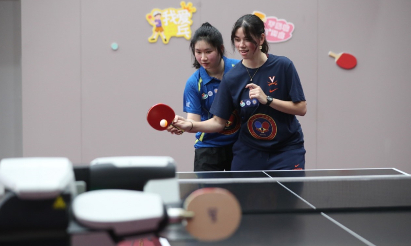 Wu Yiman (left) helps Abigail Barr practice ping-pong in Shanghai on January 9, 2024. Photo: Courtesy of Wu and Barr