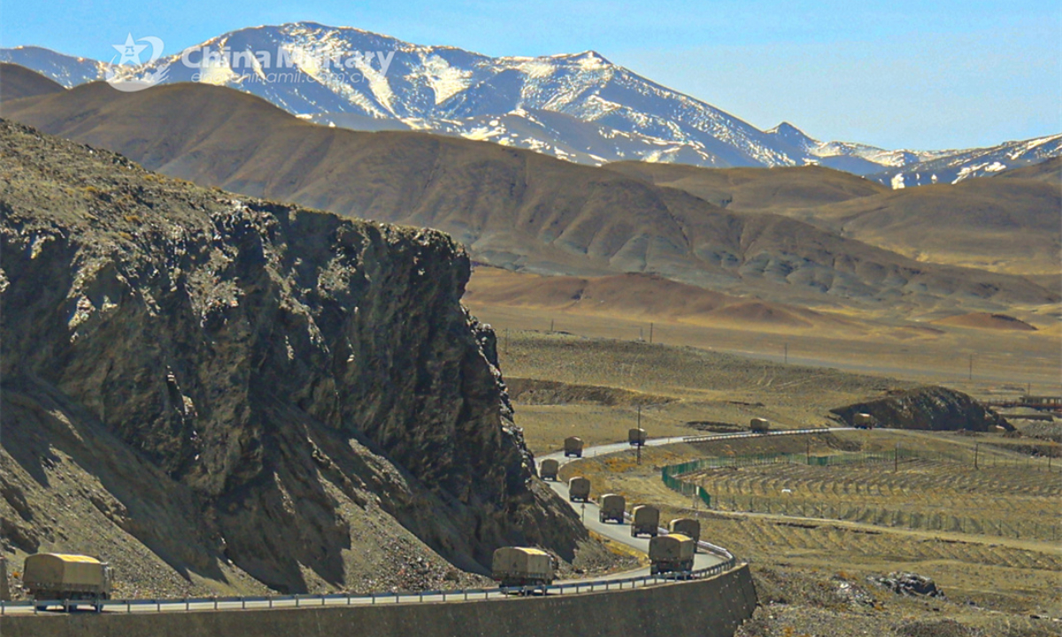 A convoy of military trucks attached to a regiment under the PLA Army moves on a zigzag road in the hinterland of a plateau region during a driving skill training exercise on April 7, 2024. (eng.chinamil.com.cn/Photo by Shang Luhang)