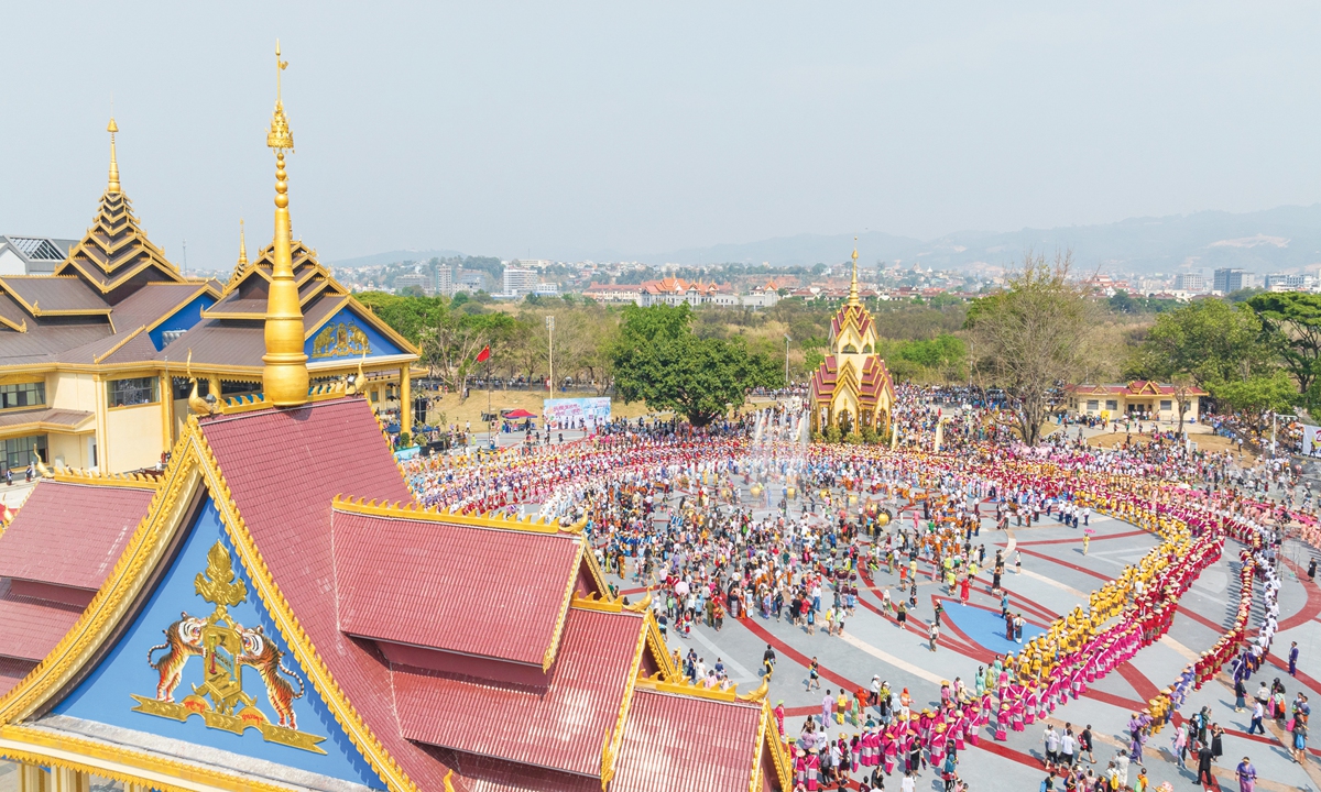 Local residents and tourists flock to a plaza to celebrate the 2024 Water-Splashing Festival in Ruili, Dehong prefecture, Southwest China's Yunnan Province, on April 14, 2024. The festival is regarded as one of the most important festivals observed by the Dai and the De'ang ethnic people in the prefecture. Photo: VCG