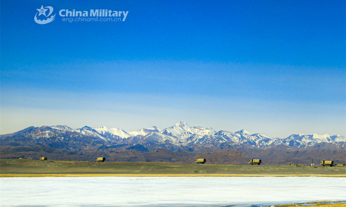 A convoy of military trucks attached to a regiment under the PLA Army moves on a zigzag road in the hinterland of a plateau region during a driving skill training exercise on April 7, 2024. (eng.chinamil.com.cn/Photo by Shang Luhang)