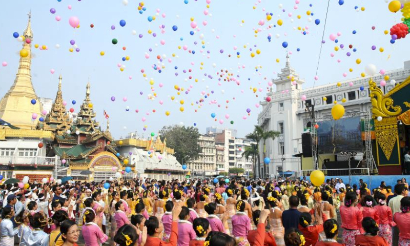 People take part in celebrations of the Thingyan water festival in Yangon, Myanmar, April 13, 2024. Myanmar's vibrant Thingyan water festival kicked off on Saturday, with celebrations taking place across the country. (Photo by Myo Kyaw Soe/Xinhua)