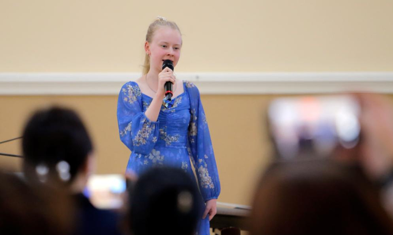 A student performs during an event organized by Confucius Institute of Transilvania University of Brasov to mark the UN Chinese Language Day in Brasov, central Romania, April 19, 2024. (Photo by Cristian Cristel/Xinhua)