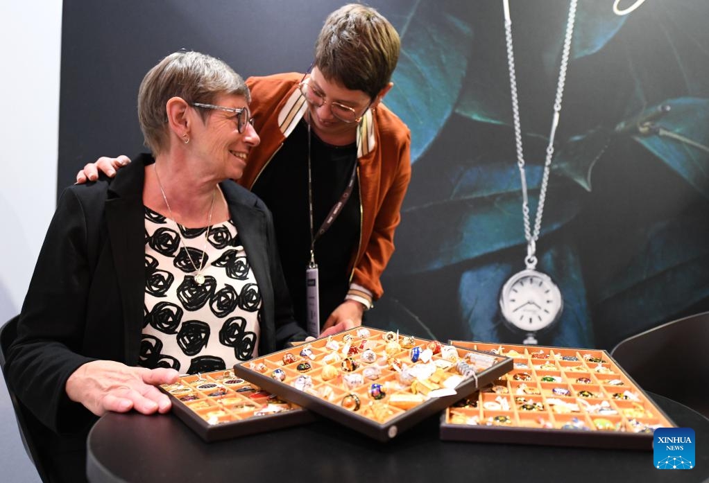 Exhibitors from Switzerland present their pendant watches at the Time to Watches 2024 exhibition in Geneva, Switzerland, April 10, 2024. The five-day exhibition kicked off here on Wednesday, showcasing 52 world-renowned independent watch brands, including BEHRENS and ATOWAK from China.(Photo: Xinhua)