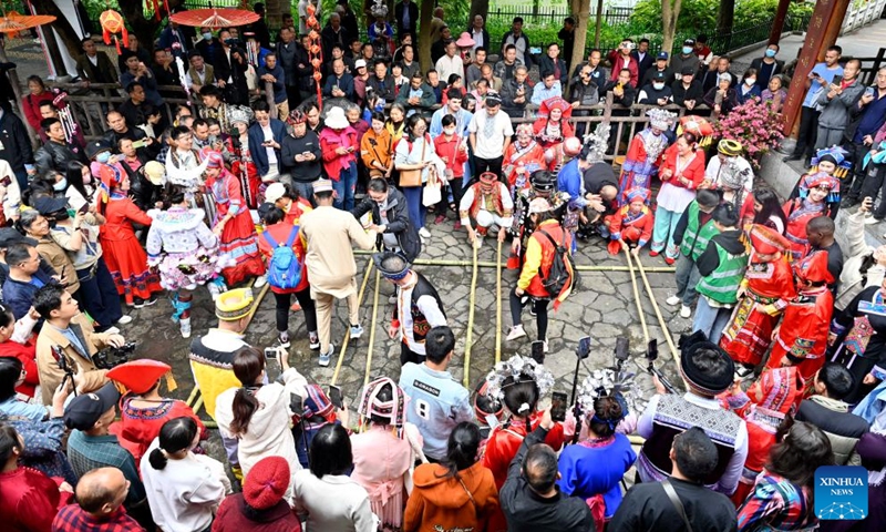Citizens and visitors perform bamboo pole dance in a celebration of Sanyuesan festival in Liuzhou, south China's Guangxi Zhuang Autonomous Region, April 8, 2024. People of Zhuang ethnic group in Guangxi celebrate the Sanyuesan Festival on the third day of the third lunar month by wearing traditional costumes and having traditional entertainments. This year's Sanyuesan Festival falls on April 11.(Photo: Xinhua)