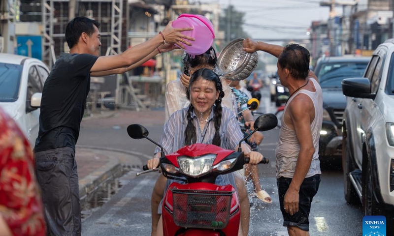 People participate in the celebration of the Songkran Festival in Vientiane, Laos, April 13, 2024. The Songkran Festival, or the Lao New Year, celebrated from April 13 to 18 this year, is the most important festival in the country. (Photo by Kaikeo Saiyasane/Xinhua)