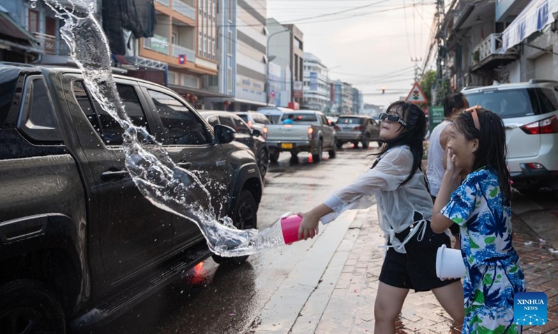 People participate in the celebration of the Songkran Festival in Vientiane, Laos, April 13, 2024. The Songkran Festival, or the Lao New Year, celebrated from April 13 to 18 this year, is the most important festival in the country. (Photo by Kaikeo Saiyasane/Xinhua)


