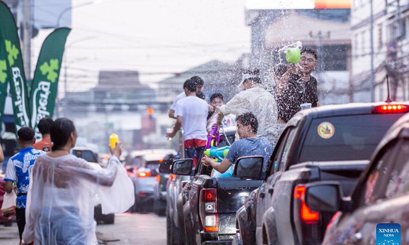 People participate in the celebration of the Songkran Festival in Vientiane, Laos, April 13, 2024. The Songkran Festival, or the Lao New Year, celebrated from April 13 to 18 this year, is the most important festival in the country. (Photo by Kaikeo Saiyasane/Xinhua)

