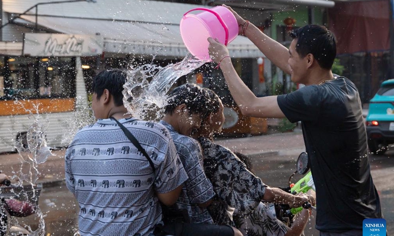 People participate in the celebration of the Songkran Festival in Vientiane, Laos, April 13, 2024. The Songkran Festival, or the Lao New Year, celebrated from April 13 to 18 this year, is the most important festival in the country. (Photo by Kaikeo Saiyasane/Xinhua)