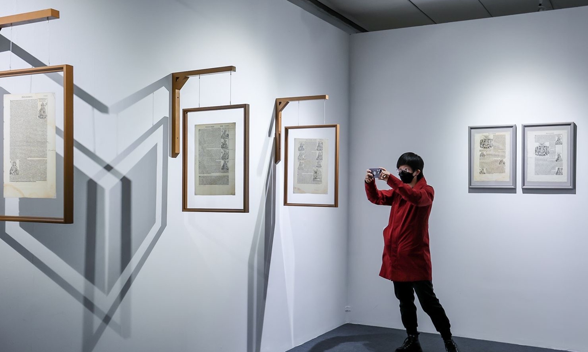 A visitor explores the exhibition. Photo: Courtesy of Guardian Art Center