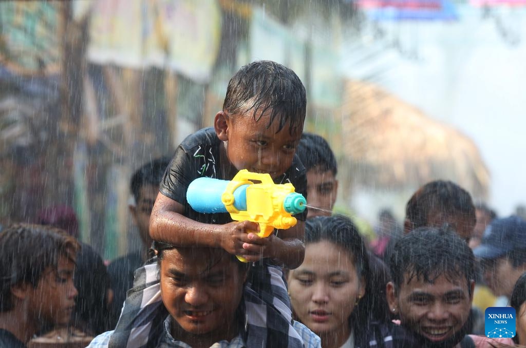 A child plays with a toy water gun during the water festival in Yangon, Myanmar, April 15, 2024.(Photo: Xinhua)