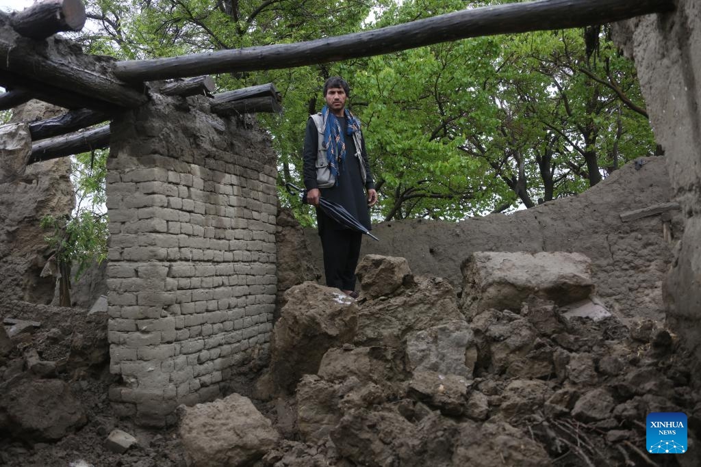 A man stands on the ruins of a dwelling destroyed by the flood in east Afghanistan's Parwan Province, April 15, 2024. Thirty-three people have lost their lives and 27 others sustained injuries as heavy rain, snowfall and flash floods swept through parts of Afghanistan over the past three days, spokesman for the national disaster authority Mullah Janan Saeq said Sunday.(Photo: Xinhua)