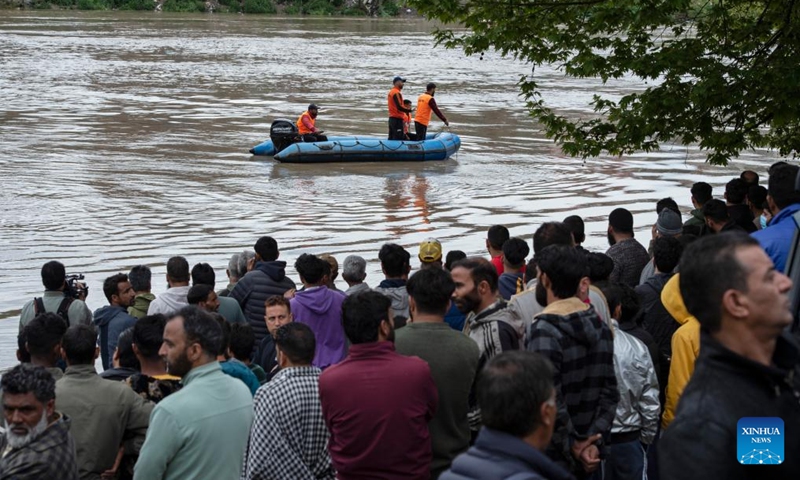Rescuers search for missing people after a boat capsized in a river in Srinagar, the summer capital of Indian-controlled Kashmir, April 16, 2024. At least six people, including four school children, were killed and many others went missing Tuesday after a boat carrying them capsized in Indian-controlled Kashmir, officials said.(Photo: Xinhua)