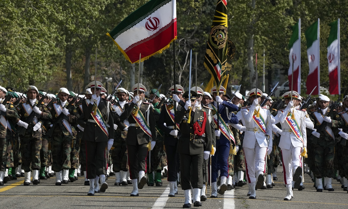 Iranian army members march during an Army Day parade at a military base in northern Tehran, Iran, on April 17, 2024. In the parade, Iranian President Ebrahim Raisi warned that the 