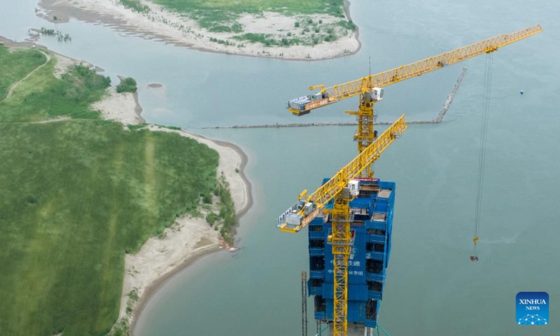 An aerial drone photo taken on April 16, 2024 shows the construction site of Zhongxiang Hanjiang grand bridge in Jingmen, central China's Hubei Province. The No. 316 main tower of Zhongxiang Hanjiang grand bridge was successfully capped on Tuesday. The grand bridge is a key project of the Wuhan-Yichang section of a high-speed railway linking east China's Shanghai, southwest China's Chongqing and Chengdu of southwest China's Sichuan Province.(Photo: Xinhua)