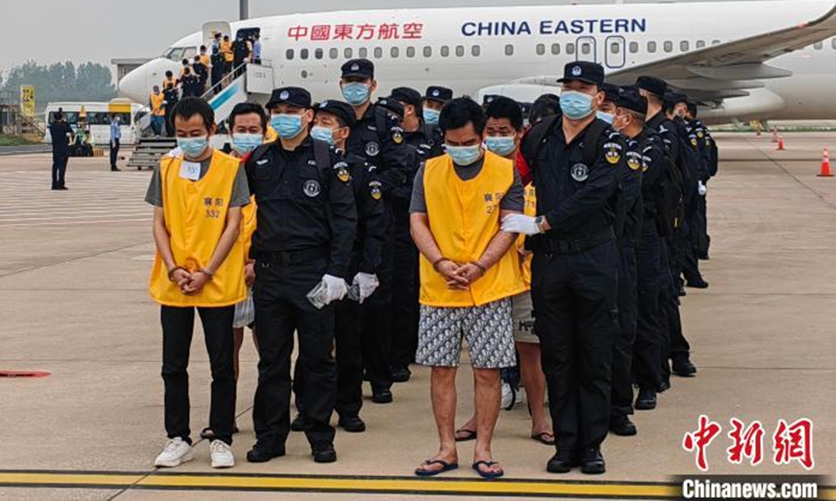 The most recent group of 135 suspects involved in illegal cross-border gambling and fraud were escorted back to China from Cambodia by two chartered planes on April 21, 2024. Photo: China News Service