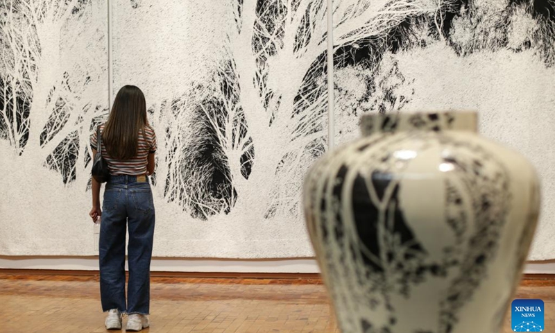 A woman visits the Atlas exhibition by artists Jan Hendrix of the Netherlands at the Citibanamex Culture Palace, in Mexico City, Mexico, on April 16, 2024.(Photo: Xinhua)