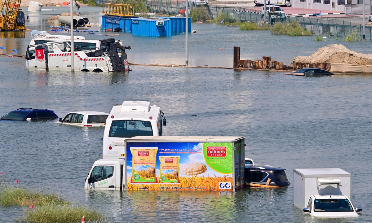 Cars are stranded on a flooded street in Dubai following heavy rains on April 18, 2024. Dubai's giant highways were clogged by flooding and its major airport was in chaos as the Middle East financial center remained gridlocked on April 18, one day after the heaviest rains on record. (See story on Page 4) Photo: AFP