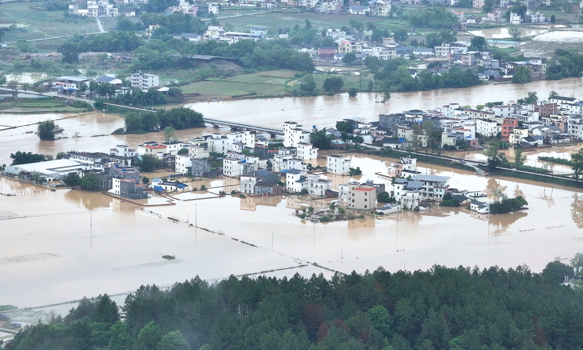 Rising water from the Dongguanshui River caused by continuous rainfall floods a village in Qingyuan, South China's Guangdong Province, on April 21, 2024. Photo: VCG