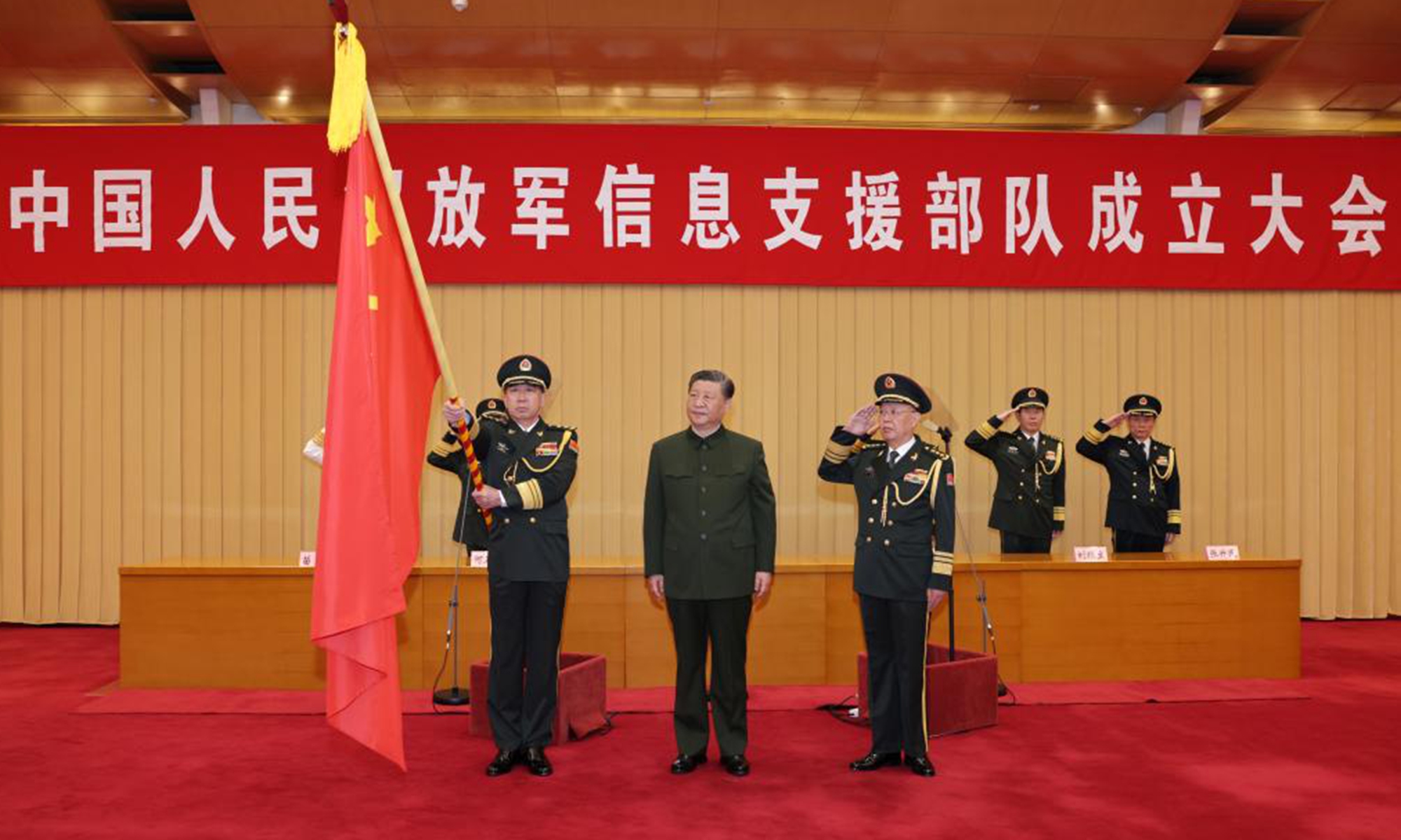 Chinese President Xi Jinping, also general secretary of the Communist Party of China (CPC) Central Committee and chairman of the Central Military Commission (CMC), presents a flag to the information support force of the Chinese People's Liberation Army (PLA) at its establishment ceremony in Beijing, capital of China, April 19, 2024. (Photo:Xinhua)