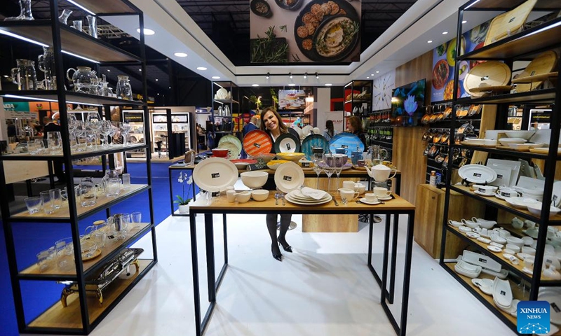 An exhibitor shows products at the 28th edition of HORECA Lebanon, an annual trade fair for the hospitality industry, in Beirut, Lebanon, on April 17, 2024. The event, held under the theme of embrace the future, kicked off here on April 16 and will last until April 19.(Photo: Xinhua)
