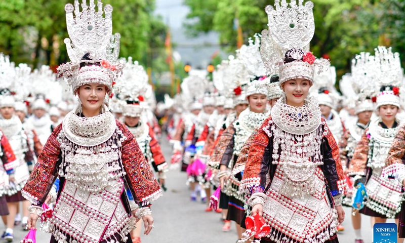 People of Miao ethnic group attend a parade to celebrate the Miao Sisters Festival in Taijiang County, southwest China's Guizhou Province, April 21, 2024.
