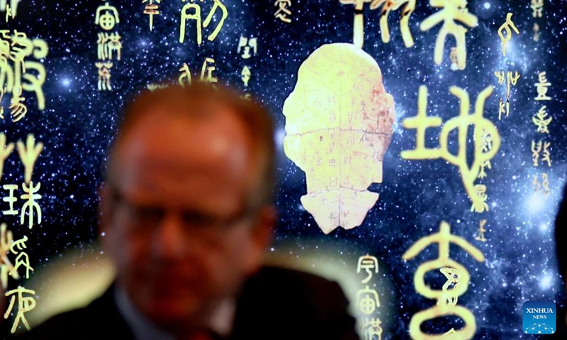 A man attends an event named Evolution of Chinese Characters in London, Britain, April 20, 2024. A special exhibition of Chinese characters was launched here on Saturday to celebrate the Chinese Language Day of the United Nations (UN). (Xinhua/Li Ying)