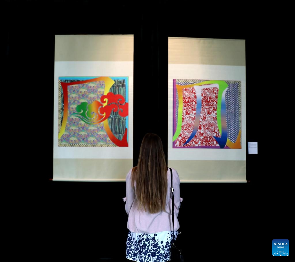 A woman attends an event named Evolution of Chinese Characters in London, Britain, April 20, 2024. A special exhibition of Chinese characters was launched here on Saturday to celebrate the Chinese Language Day of the United Nations (UN). (Xinhua/Li Ying)