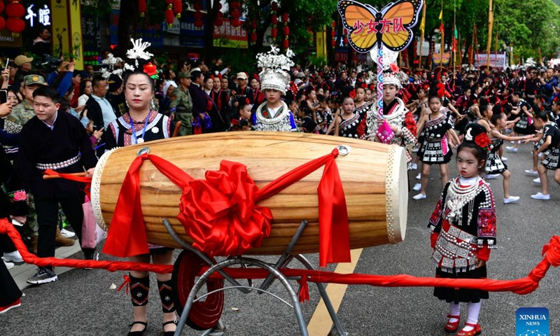 People of Miao ethnic group attend a parade to celebrate the Miao Sisters Festival in Taijiang County, southwest China's Guizhou Province, April 21, 2024.